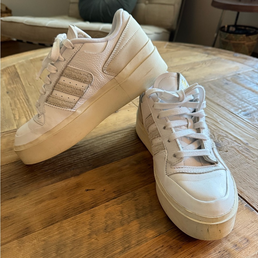 Adidas bold White with cream stripes, gold logo, size 7.5